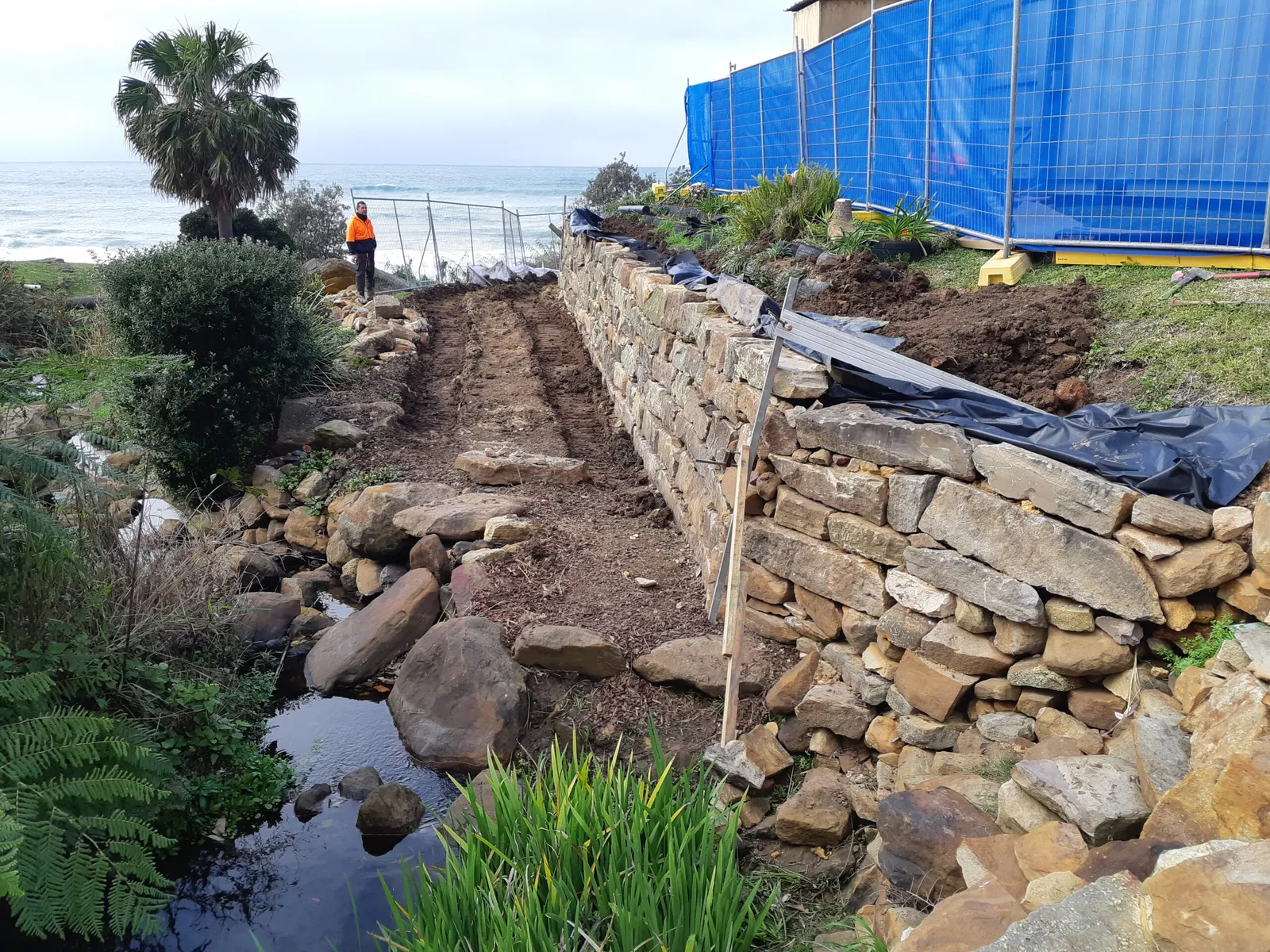 WCED excavator performing detailed earthworks on an Illawarra construction site